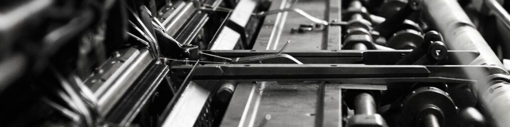 A close up image of a knitting machine.